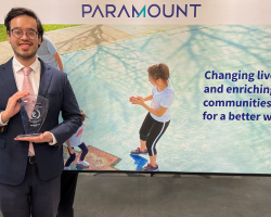 Benjamin Teo holding MSWG award