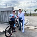 Ooi Hun Peng with a rider at Penang Fellowship Ride 2023 Bridge to Bridge