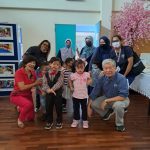 A group of kids from the foundation posing with the Kiwanis Motor Treasure Hunt organising chairman Hwang Chia Sing front right