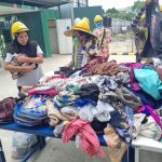 The construction workers at Paramount's site picking out clothes