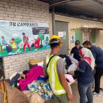 Workers picking out clothes at Paramount site