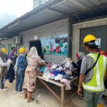 Workers picking out clothes