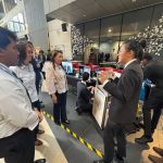 UOW Malaysia student explaining their invention to Paramount team